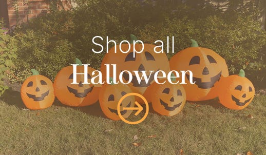 orange set of inflatable pumpkins in yard
