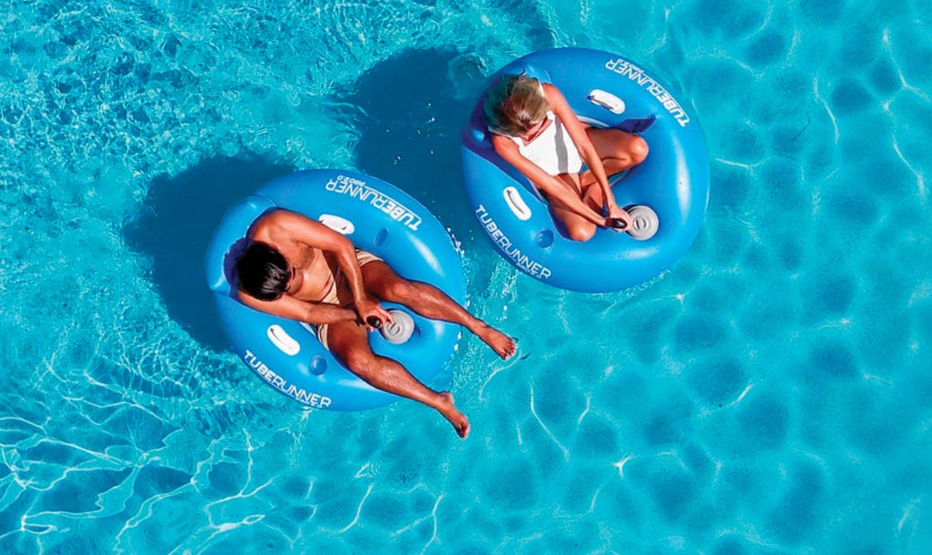 man and woman in blue Tube Runner Motorized Pool Tubes in pool