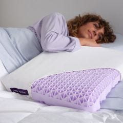 model laying with purple pillow 