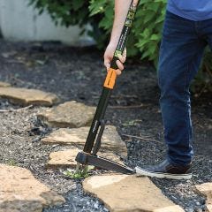 removing weeds in between rocks 