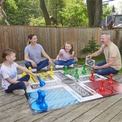 family playing the Giant Sorry game outside 