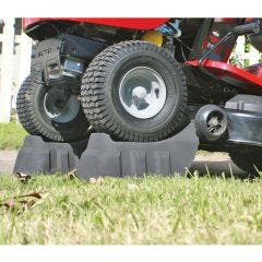 ramps holding a lawn mower up 