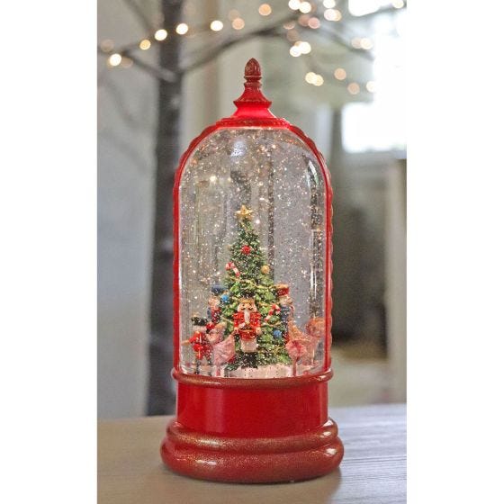 Water Globe Nutcracker in front of lights 