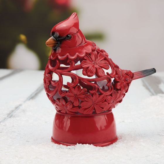 Cardinal Snow Globe on table