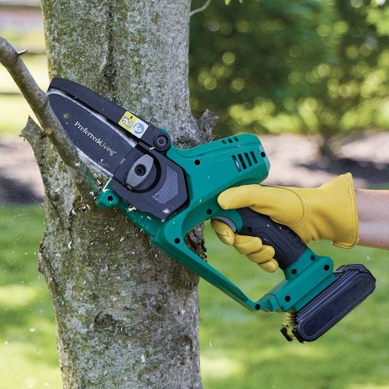 pruner saw cutting tree limbs pruner saw cutting tree limbs