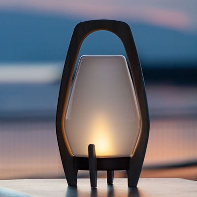 Drifter Rechargeable Outdoor/Indoor Glass LED Lantern in outdoor setting with light on