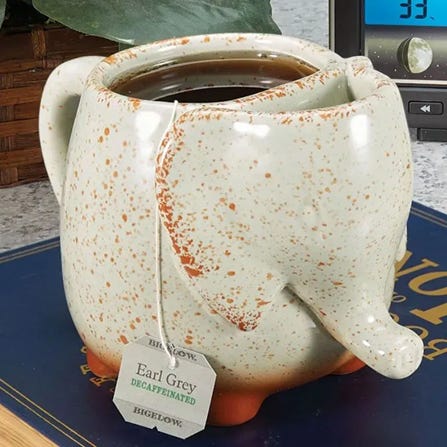 Elephant shaped tea mug with tea inside - shop now