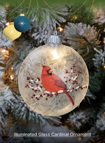Grey Illuminated Glass Cardinal Ornament hanging from Christmas Tree - shop now