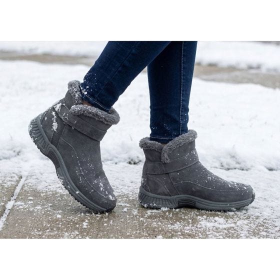 gray boots in the snow